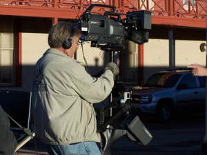 cameraman using a steady cam to film a tv commercial in HD video